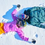Young couple having fun on the snow