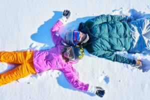 Young couple having fun on the snow